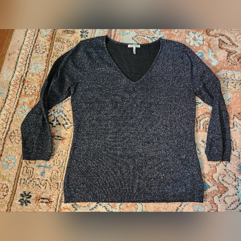 Black sweater with silver stitching. By Metro7.